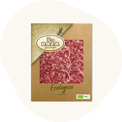 Bio Ibérico Salami, fein gemaserte Scheiben in Bio-Verpackung, auf rosa Hintergrund.