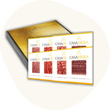Casa Íbera Aufschnitt-Set mit vier Packungen Ibérico-Schinken und Wurst in goldener Geschenkbox – spanische Feinkost aus traditioneller Herstellung.