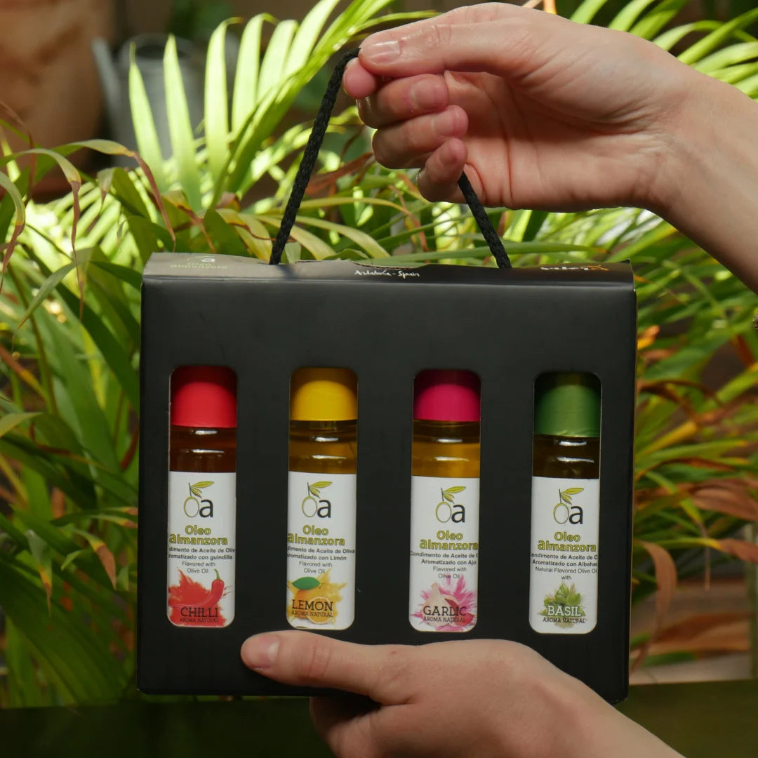 Geschenkbox mit 4 aromatisierten Olivenölen – Chili, Zitrone, Knoblauch und Basilikum in hochwertiger Verpackung