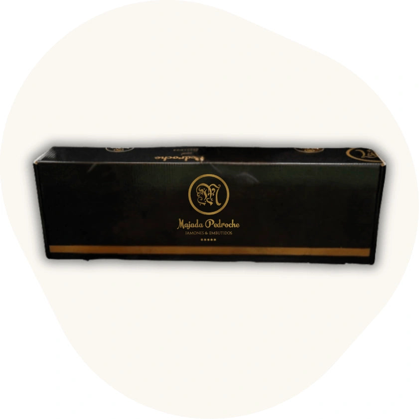 Majada Pedroche Geschenkbox für Jamón – elegante schwarze Verpackung mit goldenen Details, ideal für spanische Schinken und Delikatessen aus Los Pedroches.