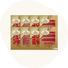 Paket mit acht Bio Baza Aufschnittpackungen aus ökologischer Herstellung, darunter verschiedene spanische Schinken- und Wurstsorten, in nachhaltiger Kartonverpackung.