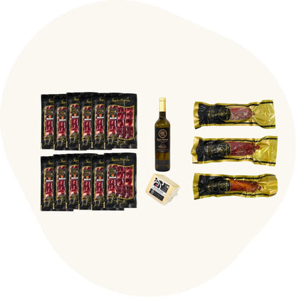Spanisches Feinkost-Set mit fein geschnittenem Pata Negra Vorderschinken, Chorizo, Salami und Schweinelende, kombiniert mit Manchego-Käse und Weißwein. Hochwertige Produkte aus den Pedroches.